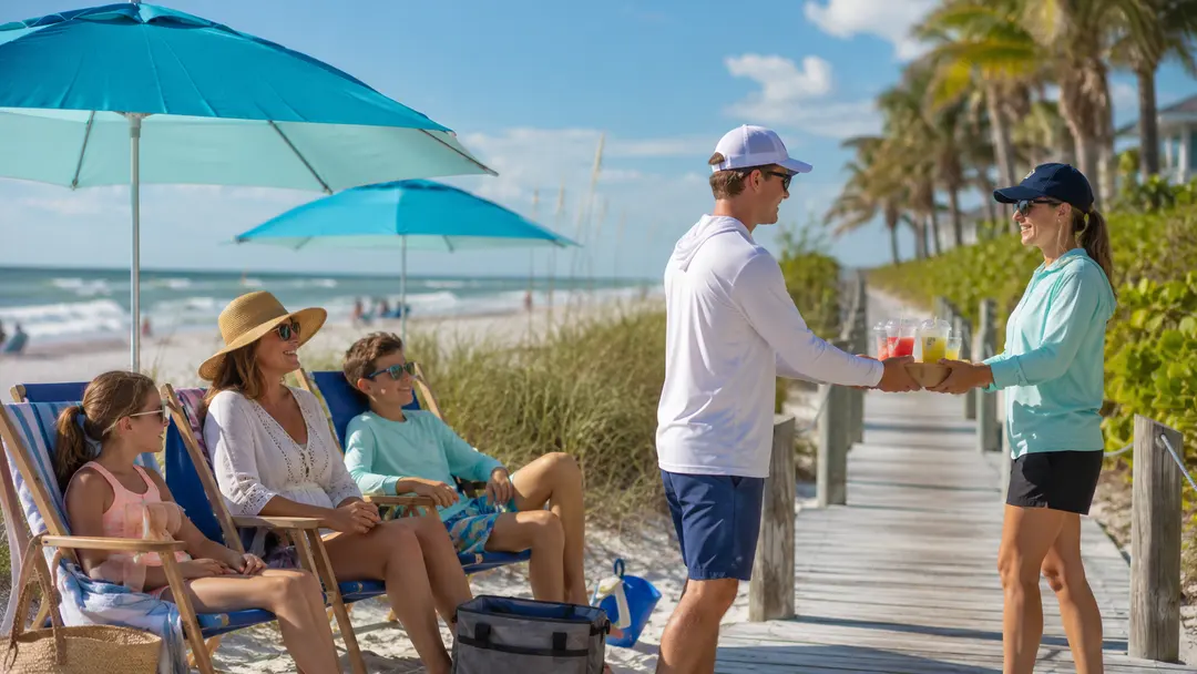 A GulfRunners runner handing cold drinks to a family at their beach chairs.